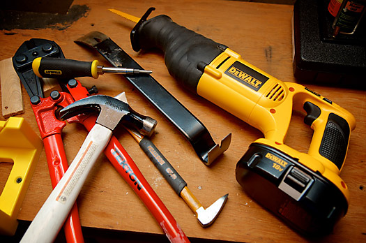 Tools for wrecking - reciprocating saw, hammer, prybar, bolt cutter, screwdriver