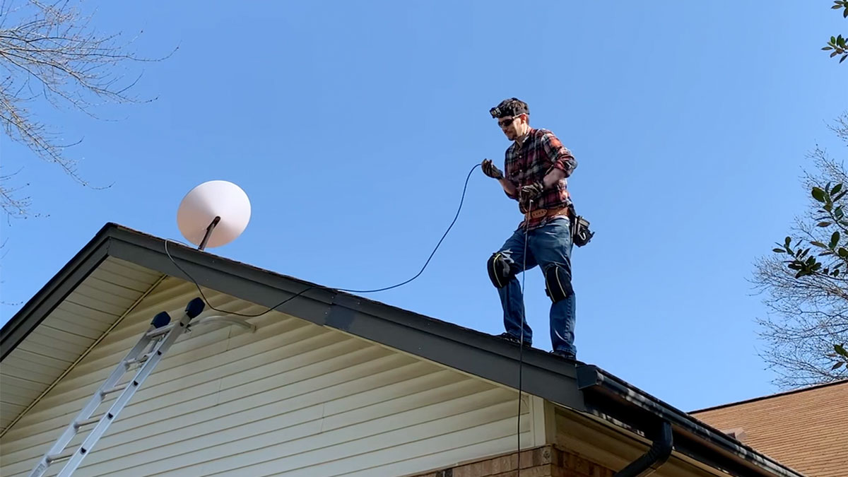 jeff installing Dishy on his roof in St. Louis MO