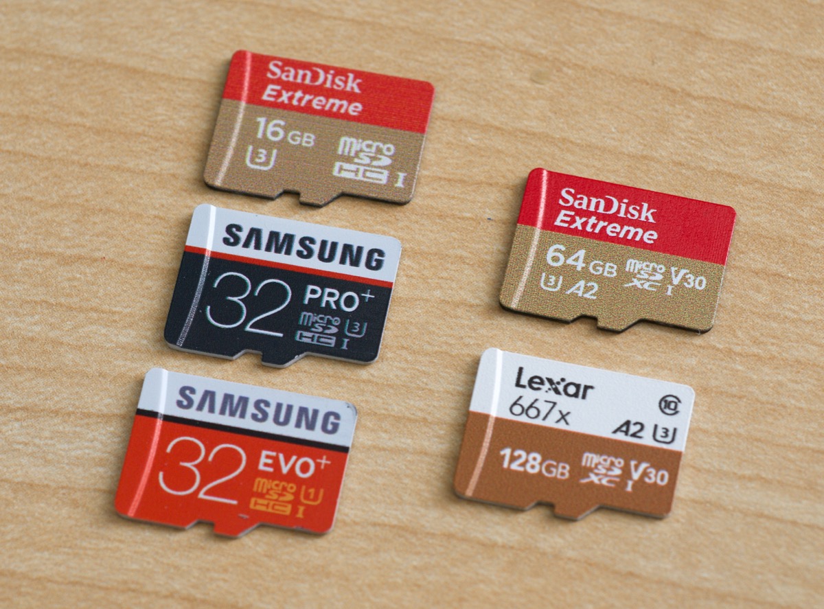 A2 Performance Class SanDisk and Lexar microSD cards next to older Samsung and SanDisk cards