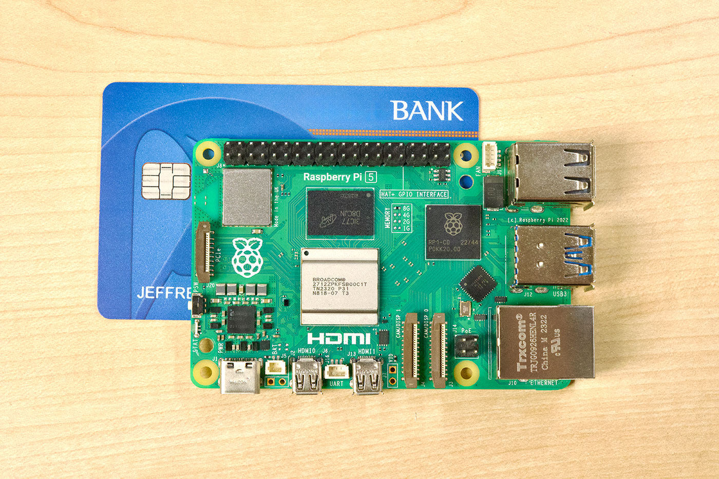 Raspberry Pi 5 model B with credit card behind it