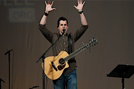 Speaker holding guitar