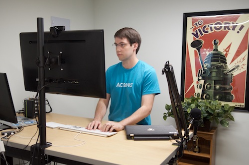 Jeff Geerling - Standing at desk in home office in his basement