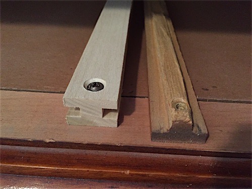 Craigslist dresser with new and fixed wood drawer rail guide next to old worn drawer rail guide