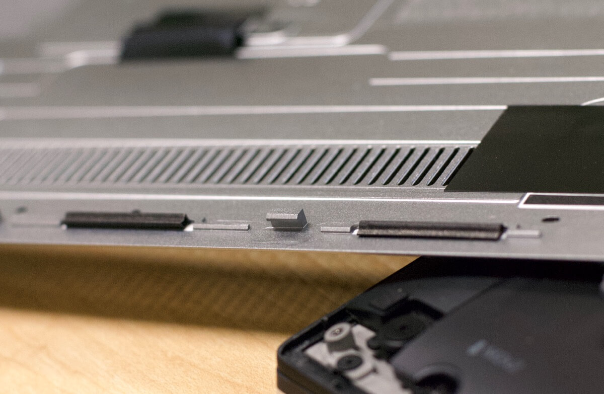 Retaining tab in bottom cover of Dell XPS 13