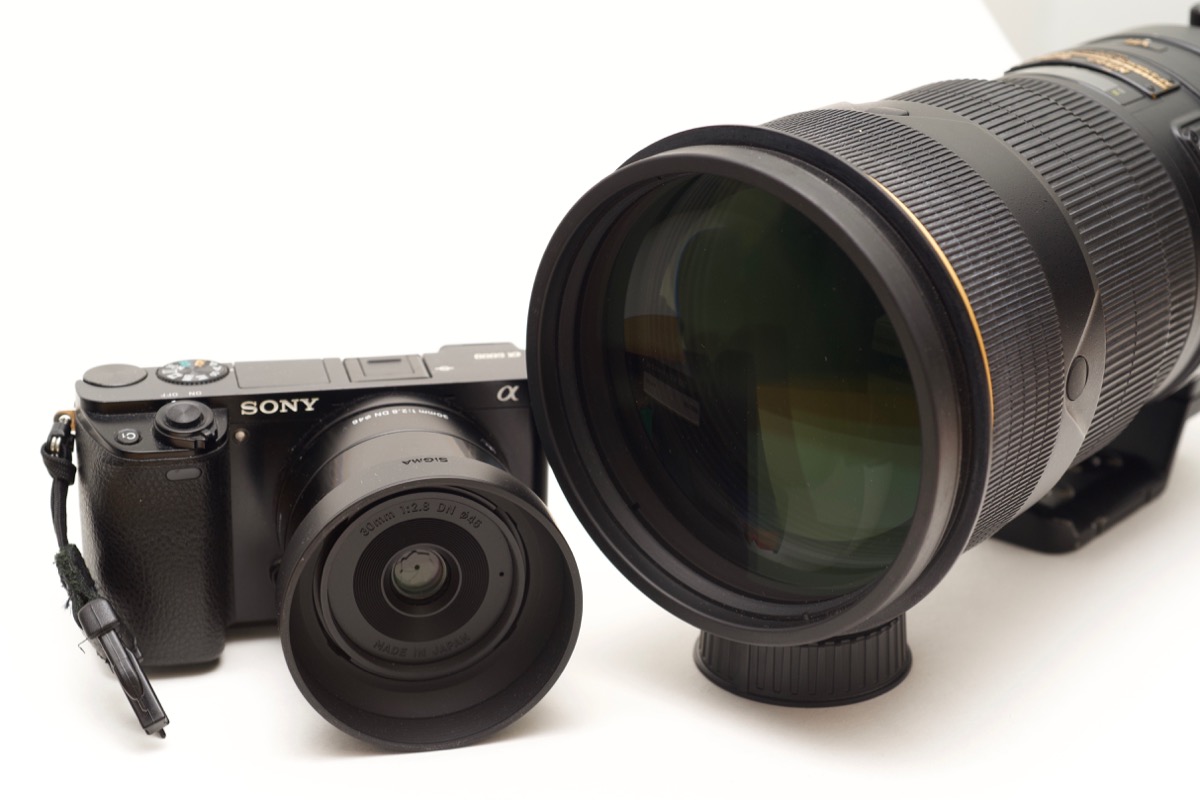 Nikon 300mm f/2.8 lens next to Sony a6000 with Sigma 30mm 2.8 Art