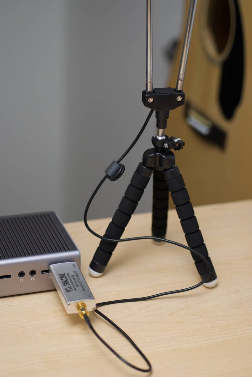 RTL-SDR Blog v3 software defined radio with dipole antenna on desk