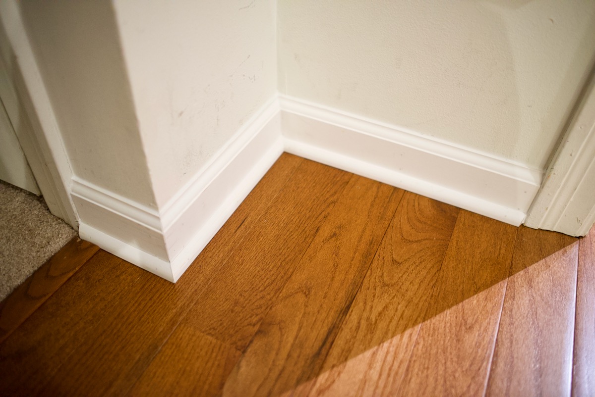 Flooring project installed and caulked base and shoe molding