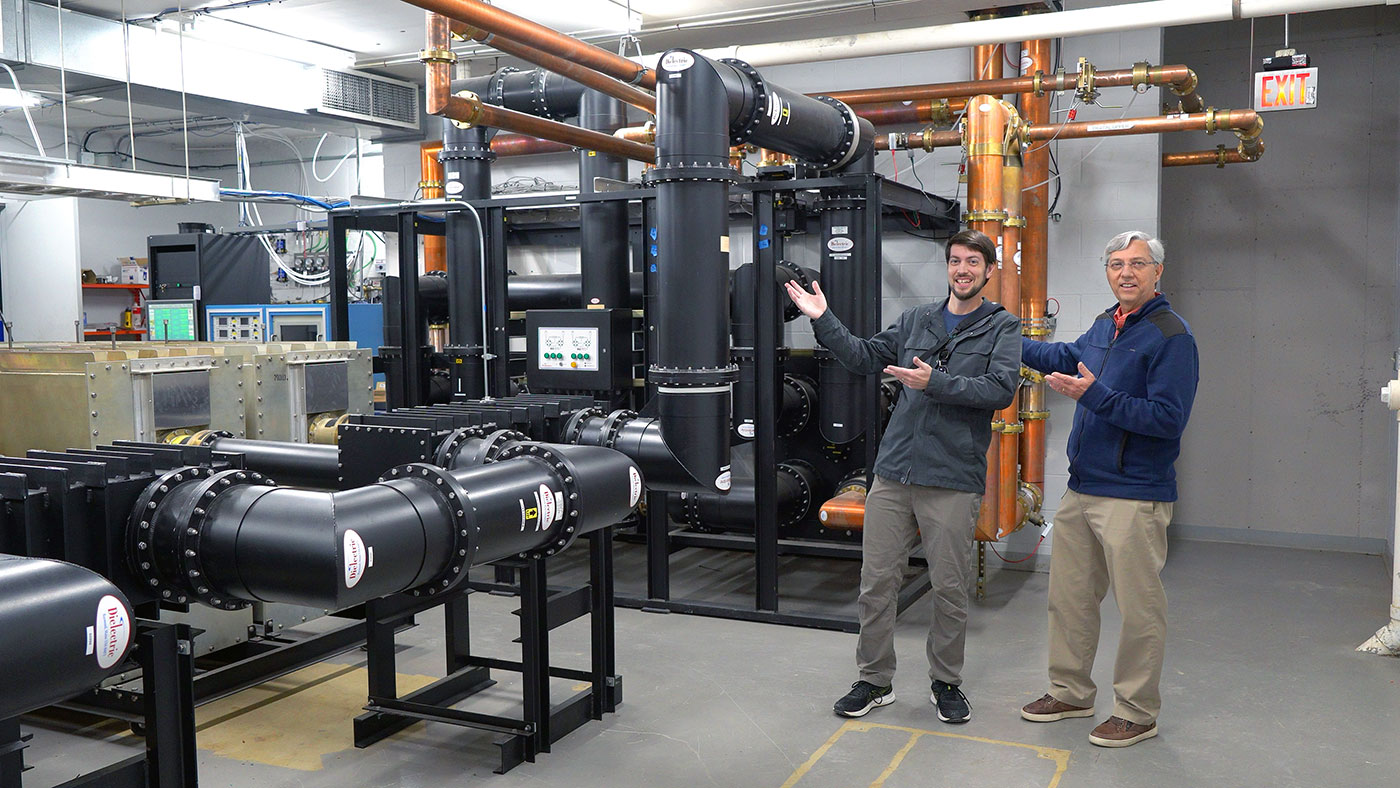 Dad and Jeff in combiner room with 9" coax 300kW RF signal