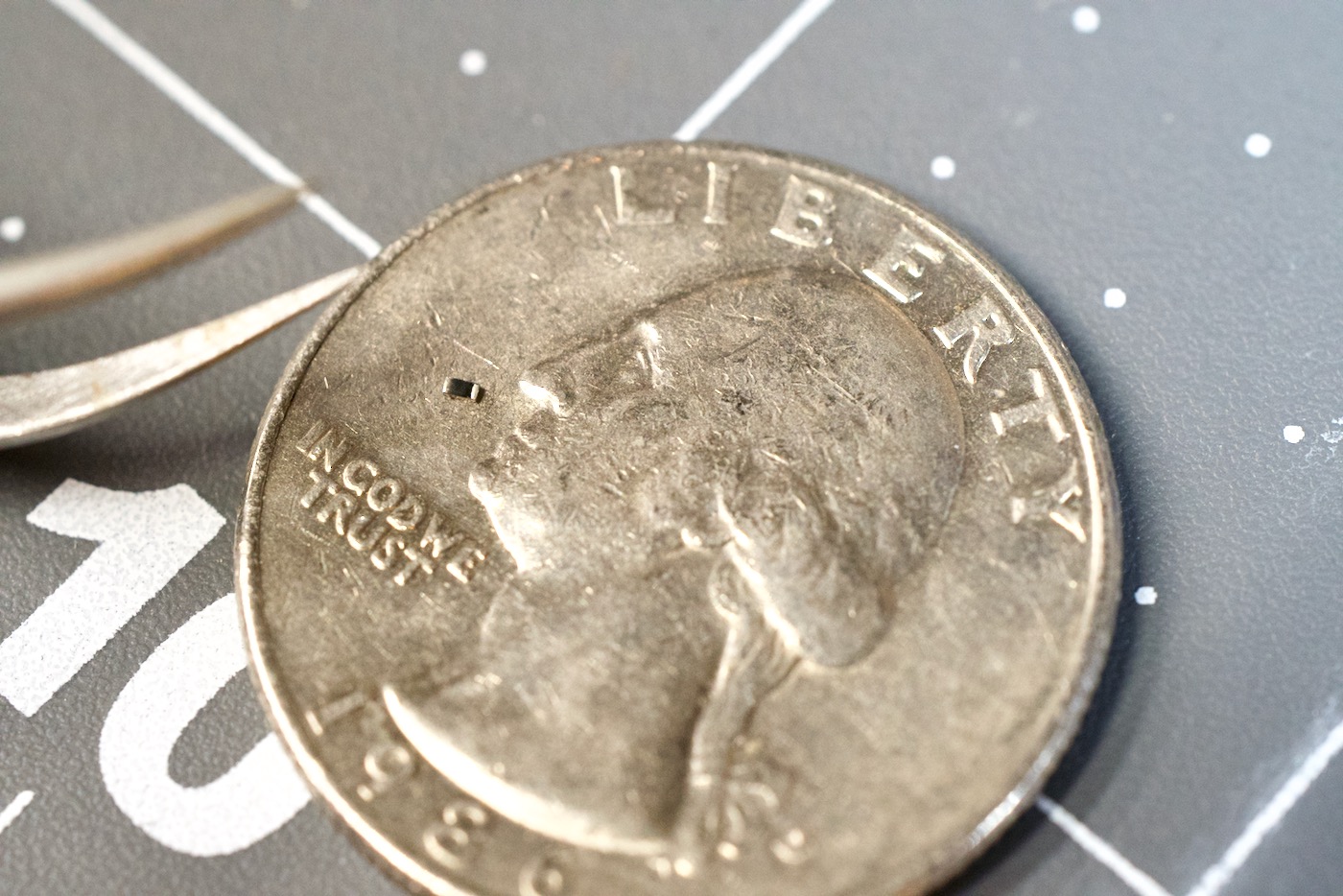 Turing Pi 2 SMD Resistor on Quarter
