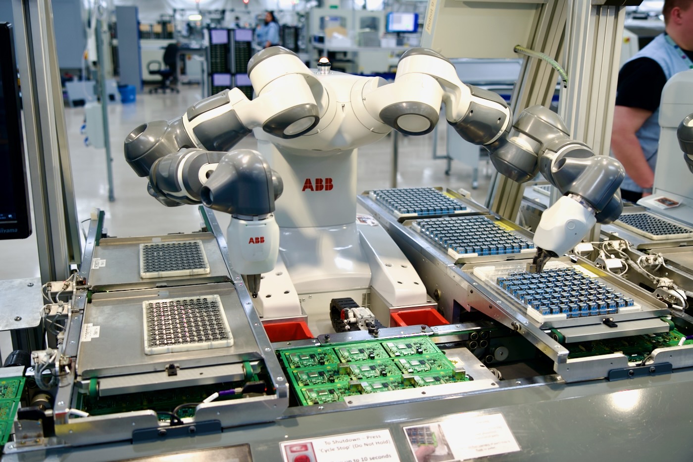 ABB robot placing through-hole components