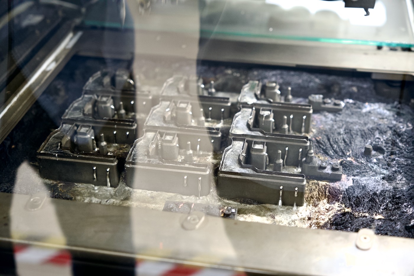 Molten metal in the solder bath for Raspberry Pi 4 production line