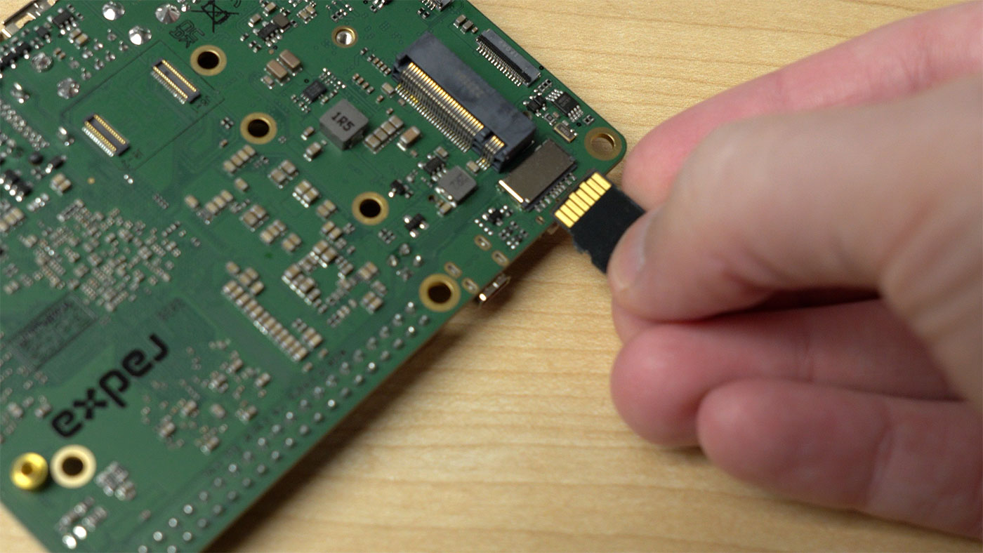 microSD card being inserted upside-down in Rock 5 model B slot