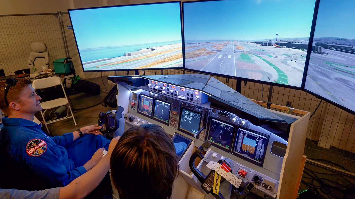 NASA astronaut Matthew Dominick landing a Boeing 737 in a 3D printed flight simulator