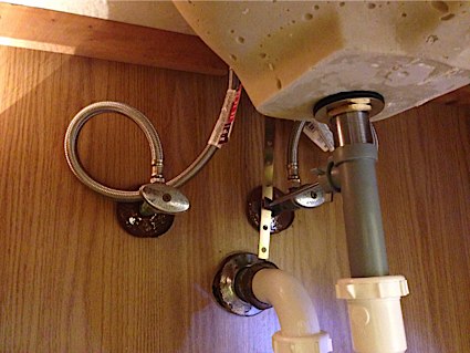 Plumbing connections under sink