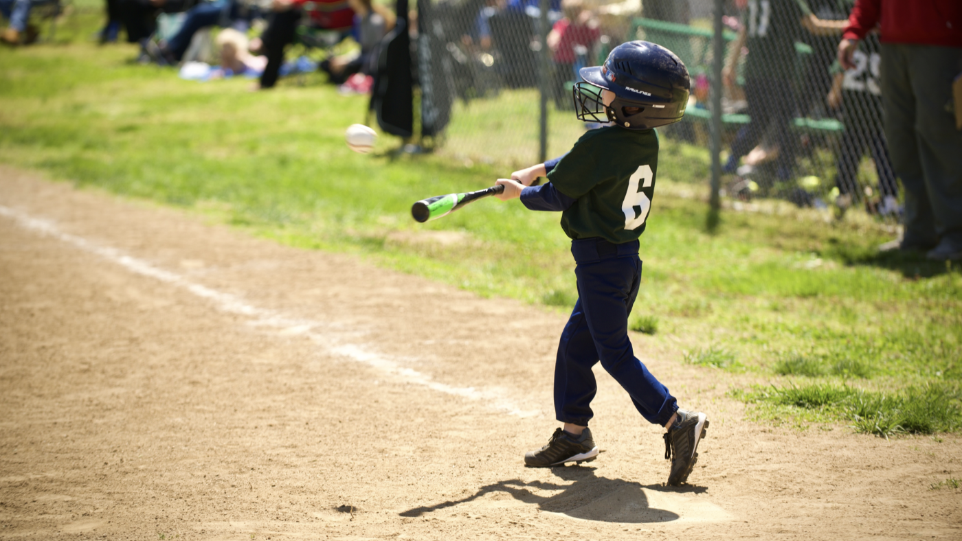 Baseball bat kid hitting