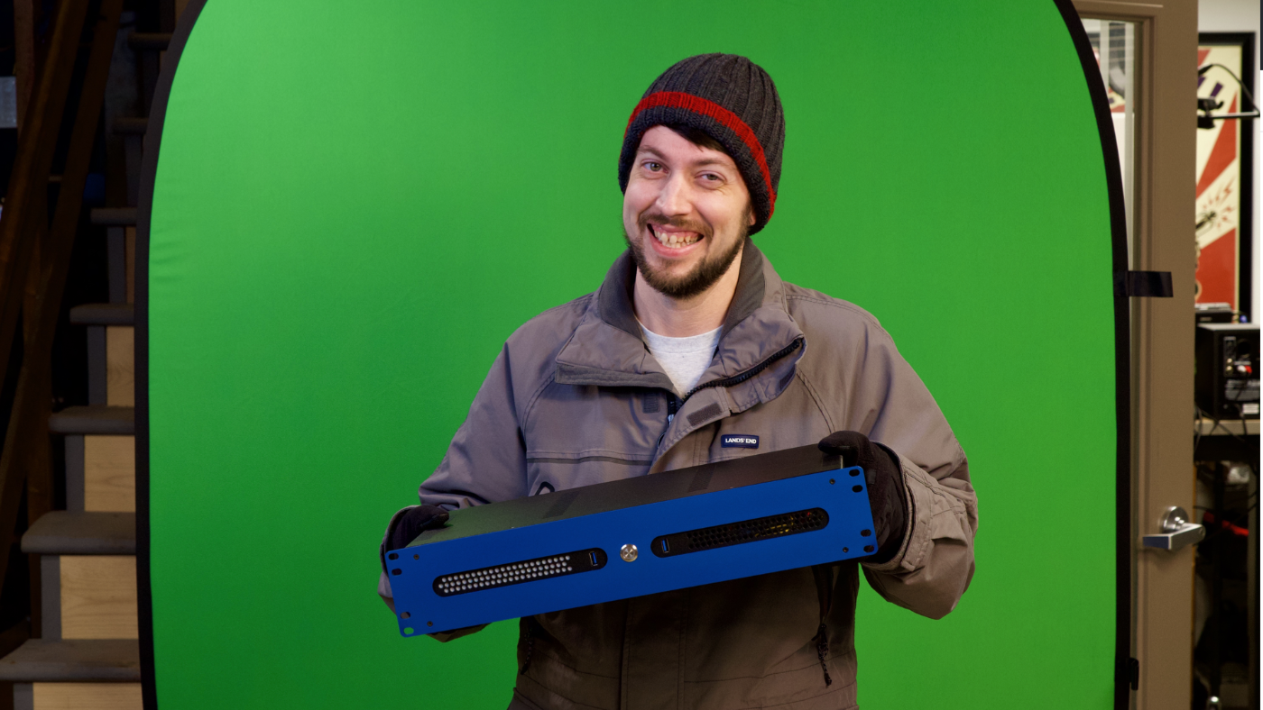 Jeff with rackmount server in front of green screen