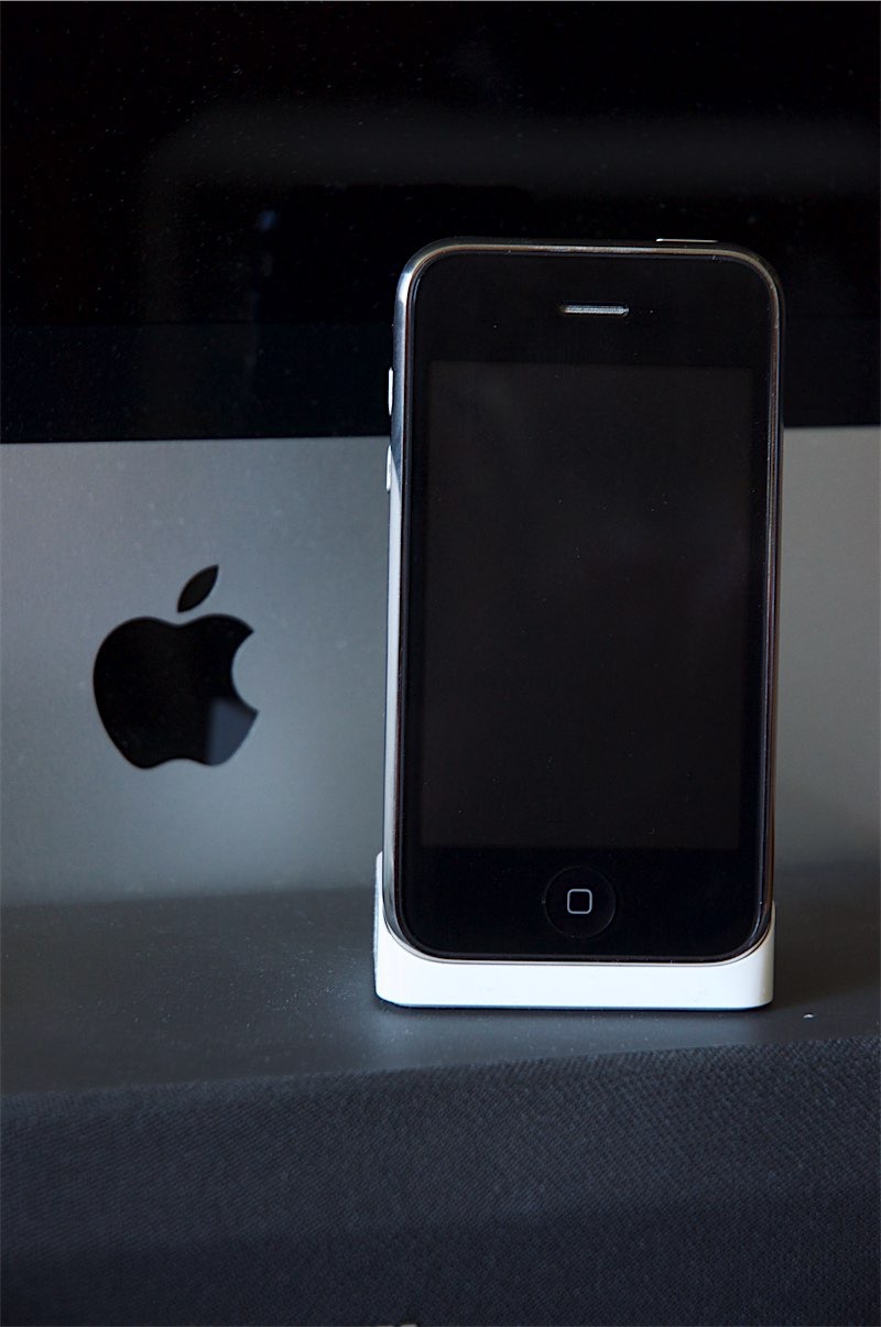 Original iPhone 2G in front of 24" Intel iMac