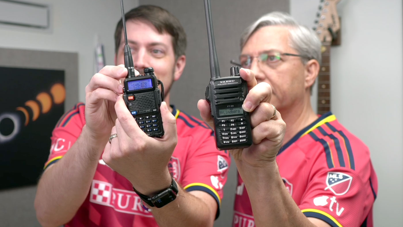 Jeff and Joe Geerling holding handheld amateur radios